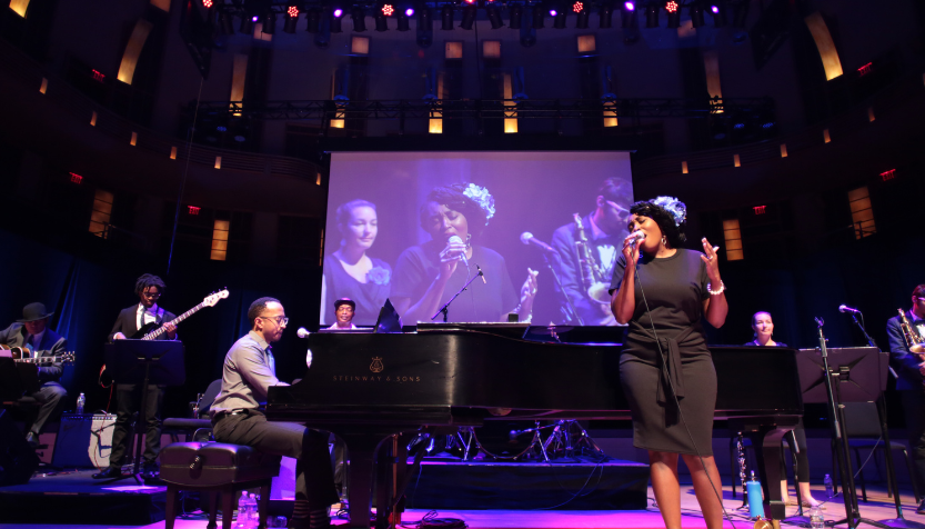Rochelle Rice performing on stage with Mark Meadows on the piano