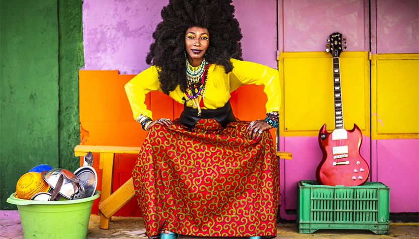 Fatoumata Diawara Seated With Guitar And Cooking Utensils