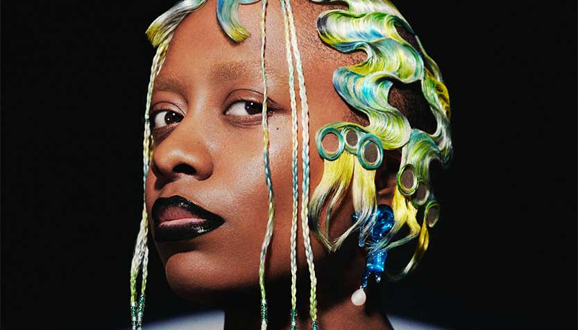 Cecile Mclorin Savant In Side Profile Looking A The Camera With Yellow And Blue Hair
