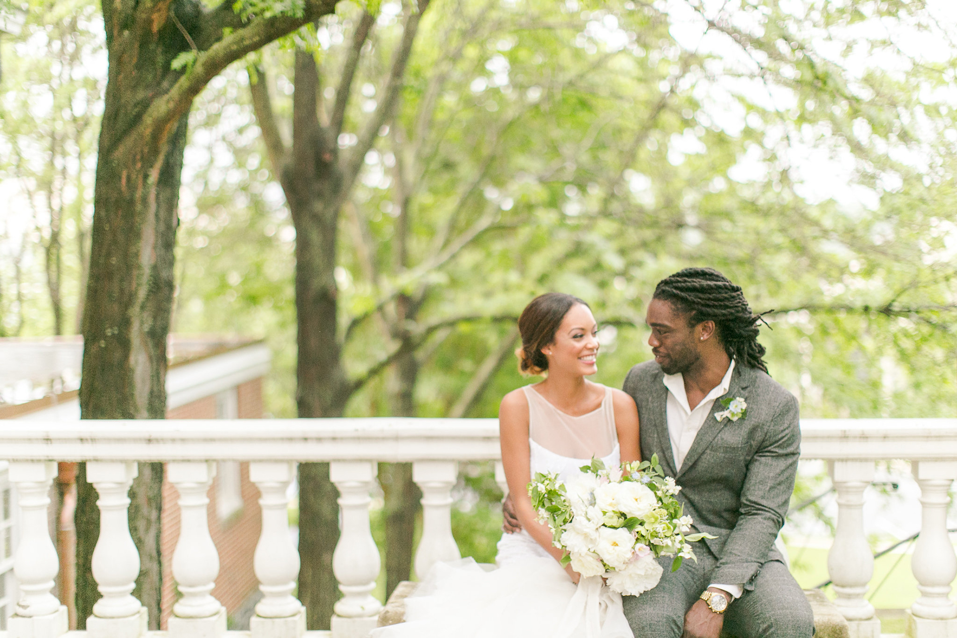 Couple on the back portico of the Mansion at Strathmore