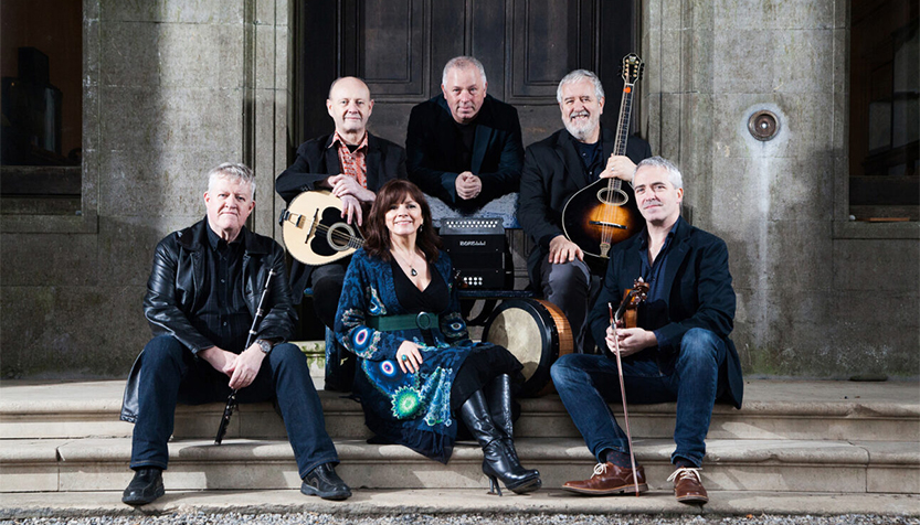 Dervish Group Sitting On Steps With Instruments