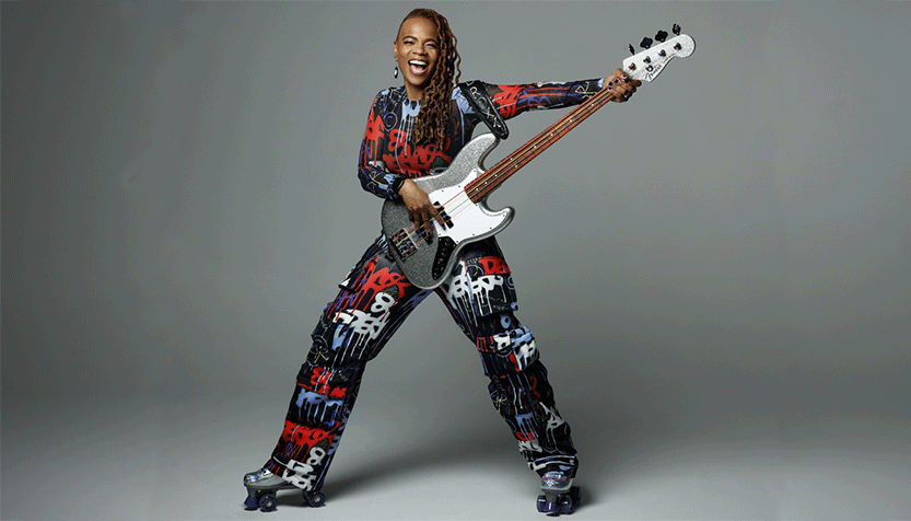 Divinity Roxx Playing Guitar On Roller Skates
