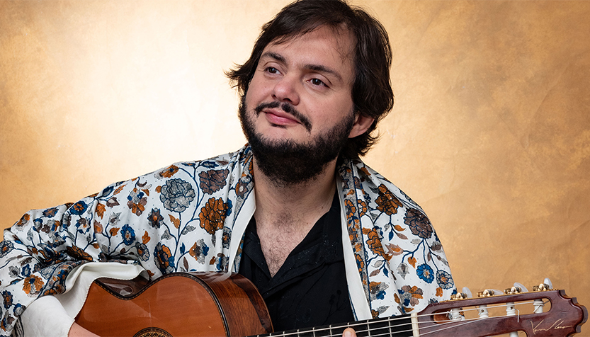 Yamandu Costa In Shawl With Guitar