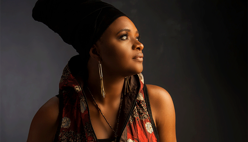 Lizz Wright In A Headdress Looking Off To The Side