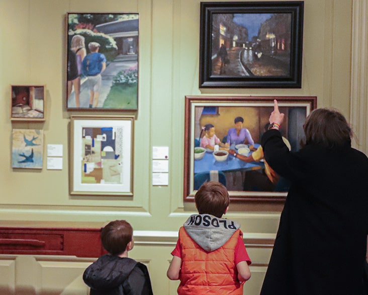 Family Looking At Art In The Mansion 732X586 Min
