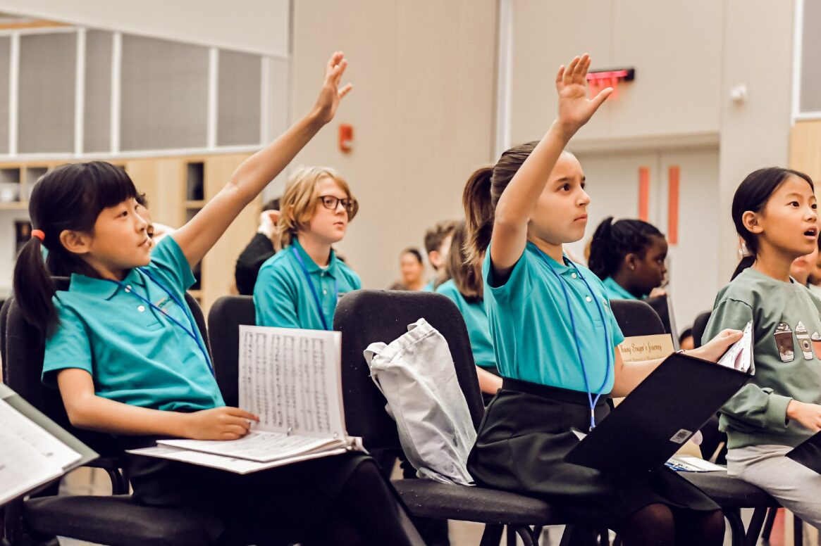 Strathmore Childrens Chorus Raising Hands In Class